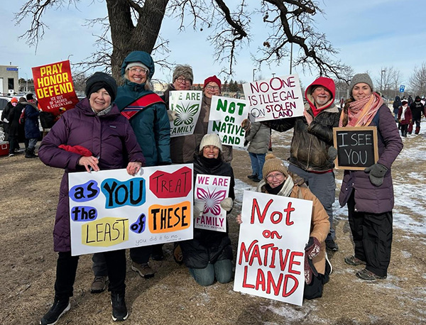 Protestors holding signs
