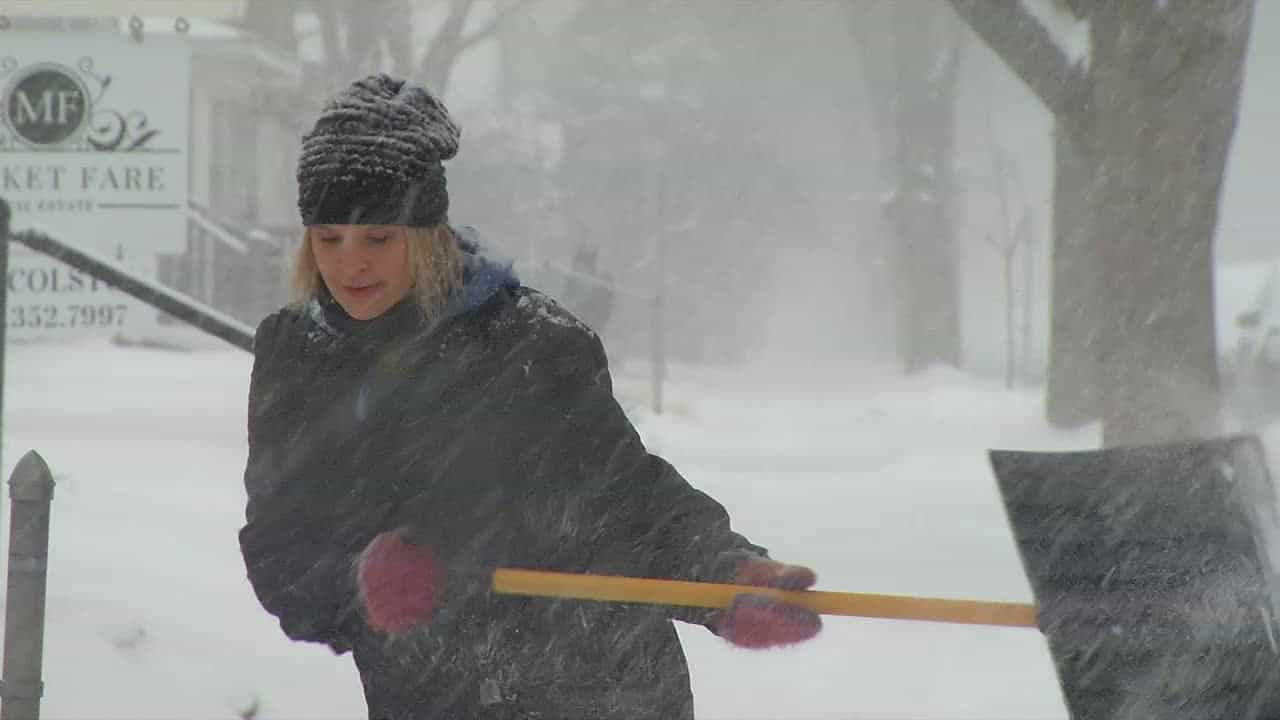 Seneca Krueger shoveling snow